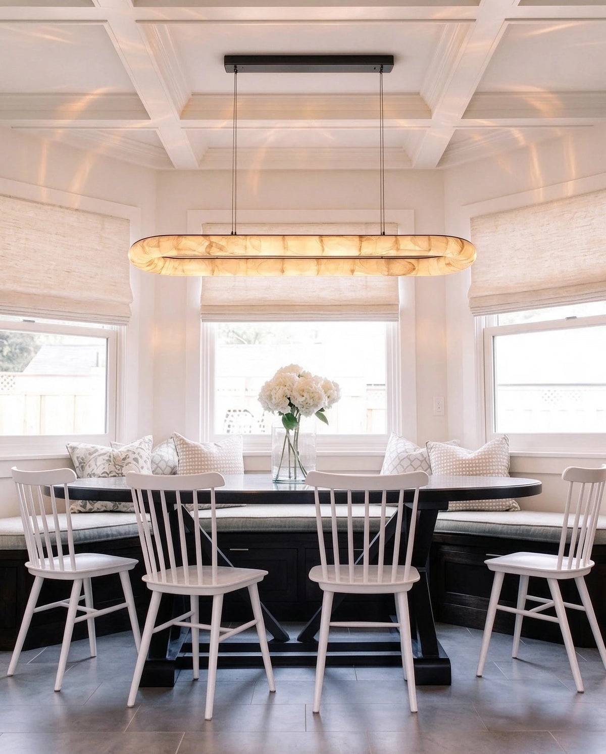 Modern Long Oval Pendant Light in Elegant Dining Room Setting