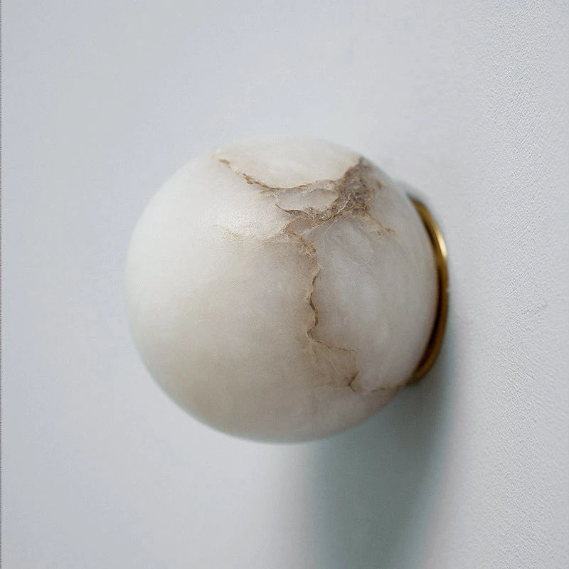 Side View of Natural Marble Vein Globe Wall Sconce Studio Shot