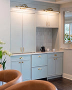Modern Brass Wall Light Over Kitchen Cabinetry