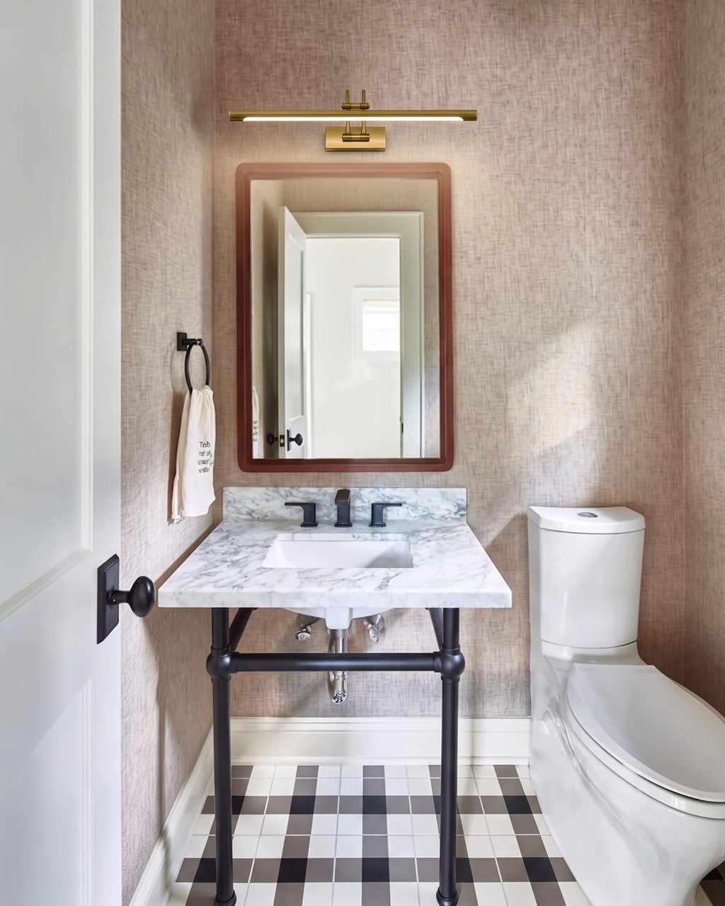 Modern Brass Wall Sconce Over Bathroom Vanity Mirror