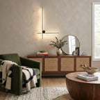 Brass Cross LED Wall Light Over Living Room Rattan Sideboard
