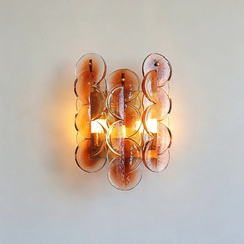 Studio Display of Illuminated Modern Amber Round Plate Art Glass Wall Sconce