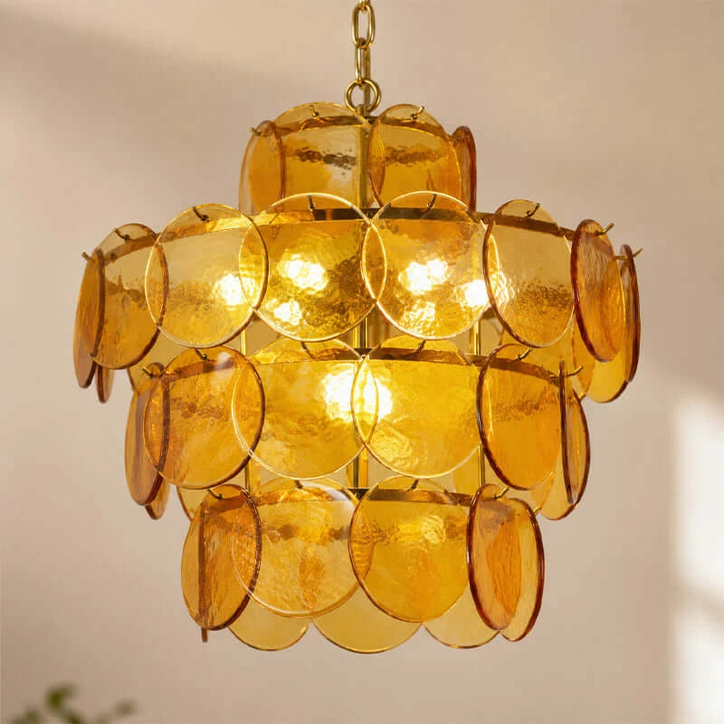 Close Up View of Illuminated Amber Disc Art Glass Chandelier