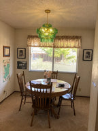 Modern Green Art Glass Chandelier in Cozy Dining Room