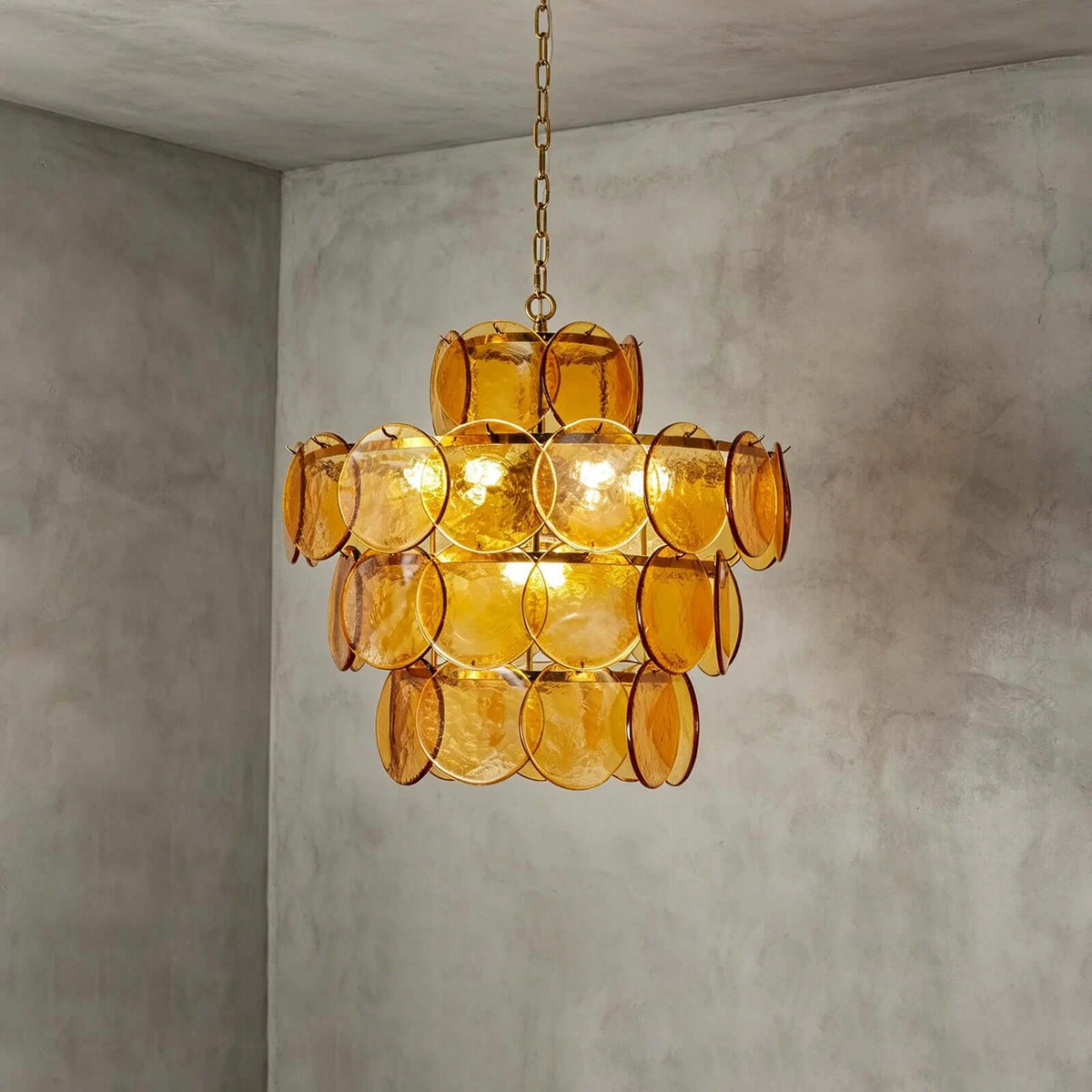 Illuminated Modern Amber Disc Art Glass Chandelier Studio Shot