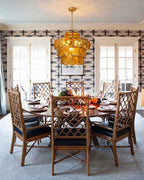 Modern Amber Disc Art Glass Chandelier Over Formal Dining Table