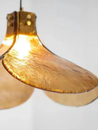 Close Up View of Illuminated Amber Petal Art Glass and Brass Connection Details