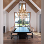 Luxury Crystal Chandelier Over Long Formal Dining Table