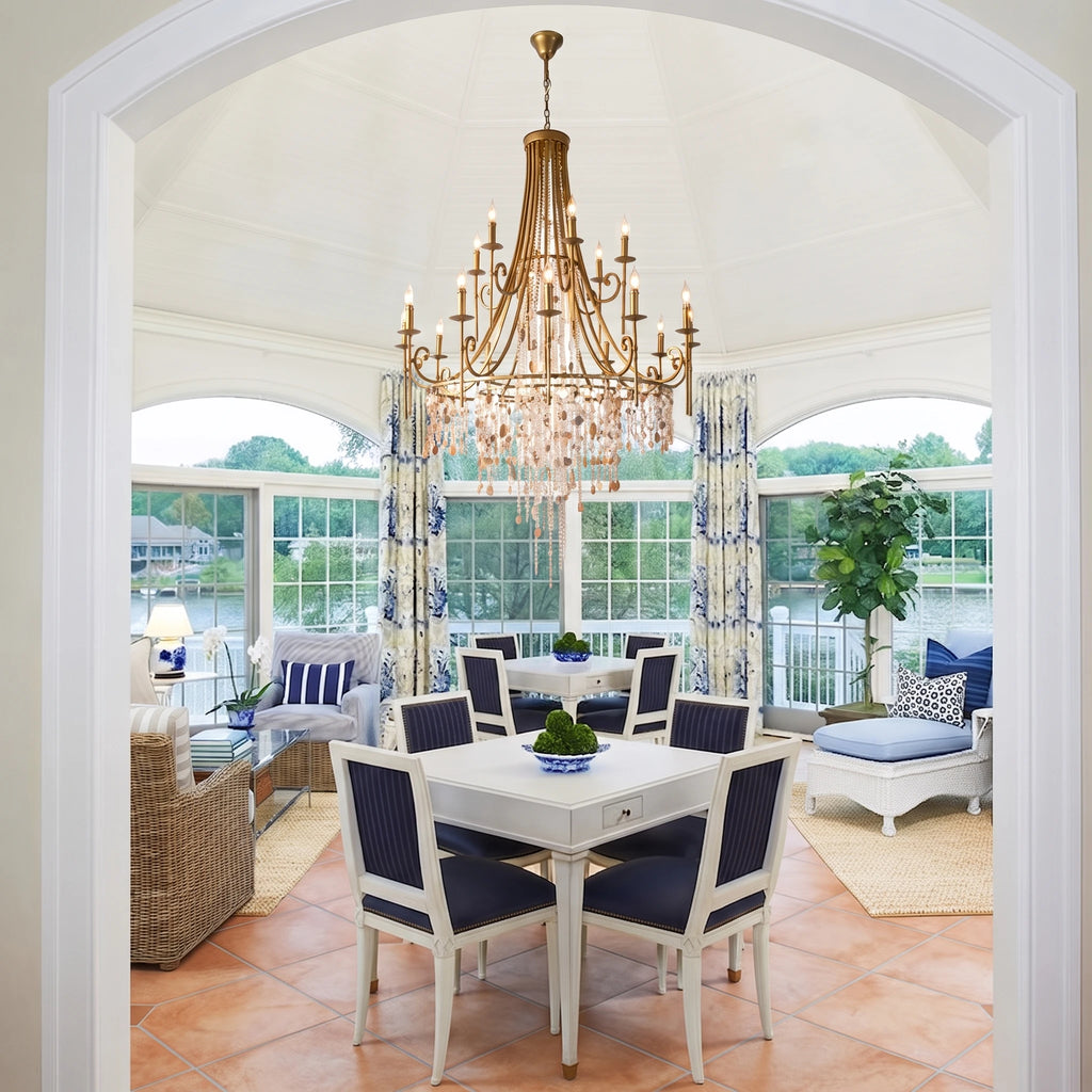 Crystal Chandelier Over Dining Table in Bright Sunroom
