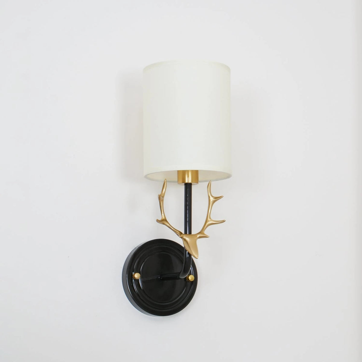 Single Black and Brass Antler Wall Light Studio Product Shot
