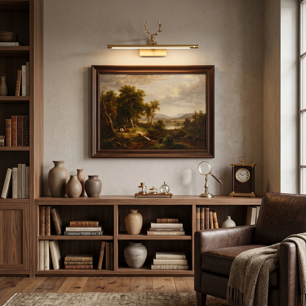 Brass Antler Picture Light Illuminating Wall Art Over Credenza