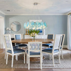 Modern Silver Frame Teal Wave Disc Chandelier in Luxury Dining Interior