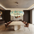 Modern Silver Frame Teal Wave Disc Chandelier Over Dining Table