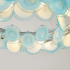 Close Up View of Teal Wave Disc Art Glass Details and Lighting