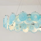 Illuminated Modern Silver Frame Teal Wave Disc Chandelier Studio Shot