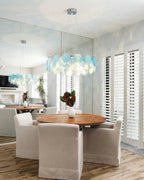 Modern Teal Layered Wave Disc Art Glass Chandelier Over Round Dining Table