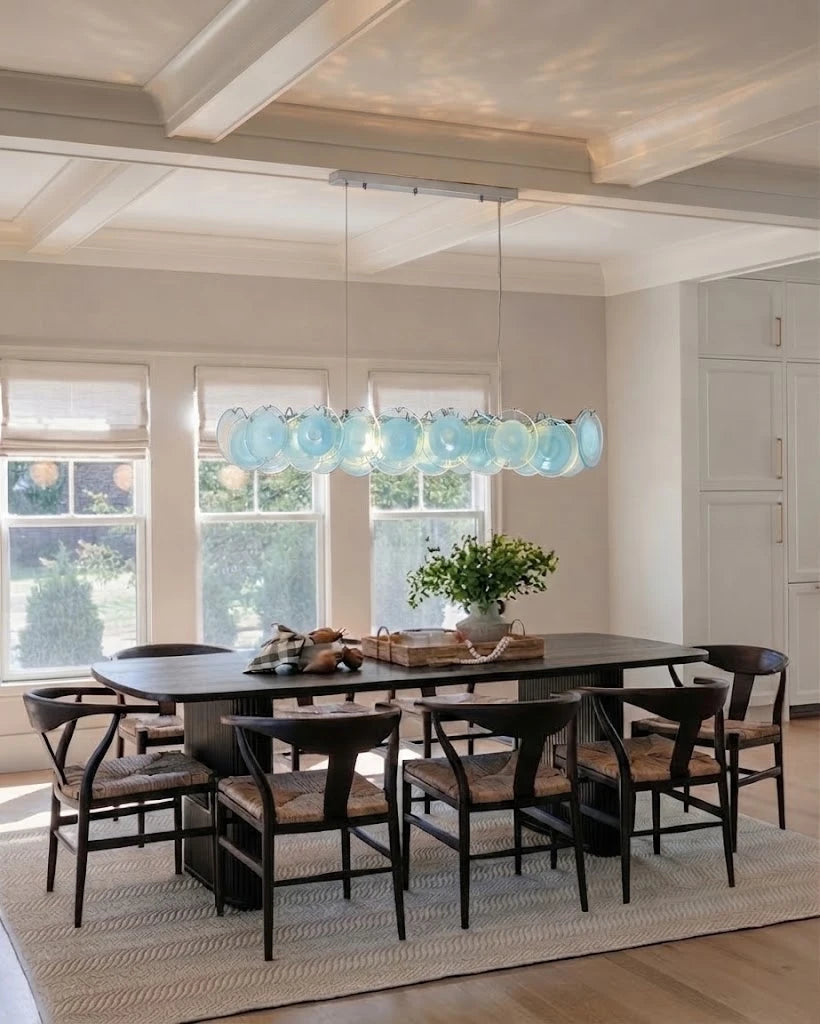 Modern Silver Frame Teal Wave Disc Linear Chandelier Over Dining Table