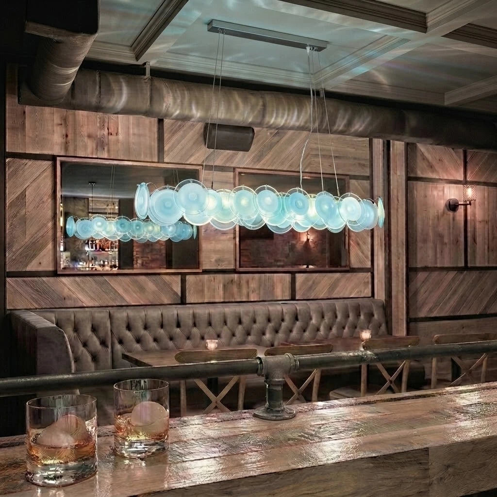 Modern Silver Frame Teal Wave Disc Linear Chandelier in Retro Lounge Bar Setting