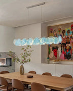 Modern Teal Layered Wave Disc Art Glass Linear Chandelier in Minimalist Interior