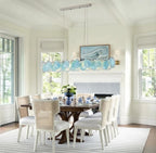 Modern Teal Layered Wave Disc Art Glass Linear Chandelier in Contemporary Dining Room