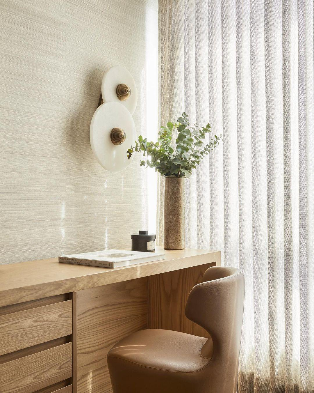 Four-piece arrangement of Solaris stone disc sconces on blank white wall
