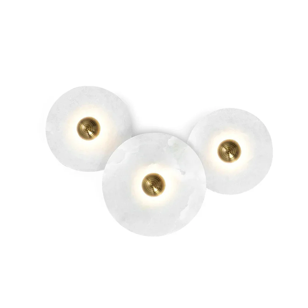 Three varied size Solaris alabaster disc sconce combination arrangement