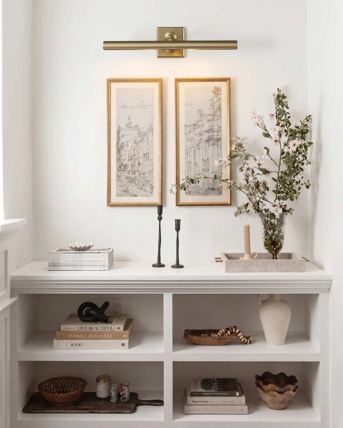 Modern Brass Picture Light Over Botanical Art in Hallway