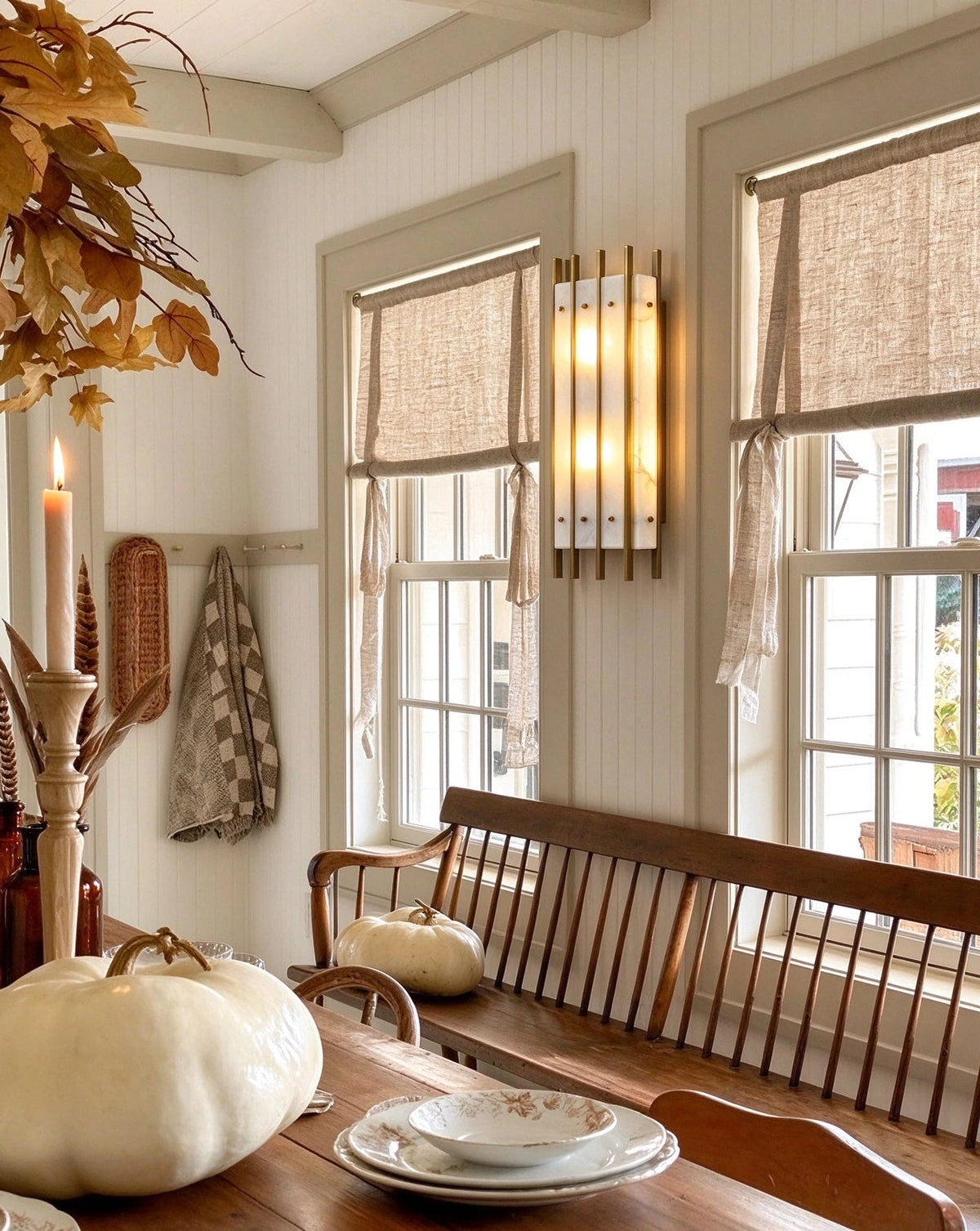 Modern Brass Alabaster Wall Sconce in Sophisticated Dining Space