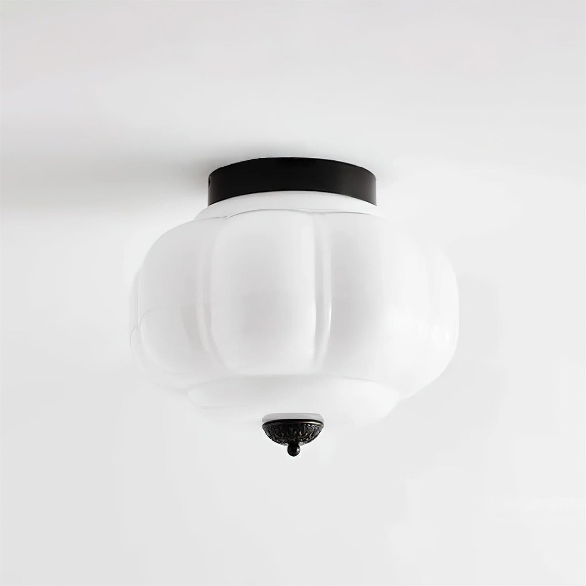 Frosted white ribbed glass flush mount ceiling lamp black metal top studio shot