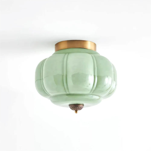 Modern Minimalist Green Pumpkin Art Glass Flush Mount Ceiling Light with Antique Brass Canopy on Pure White Background