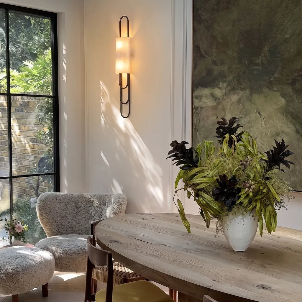 Modern Alabaster Wall Sconce in Elegant Dining Space Setting   