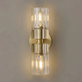Close Up View of Illuminated Modern Brass Crystal Cylinder Art Glass Wall Sconce Studio Shot