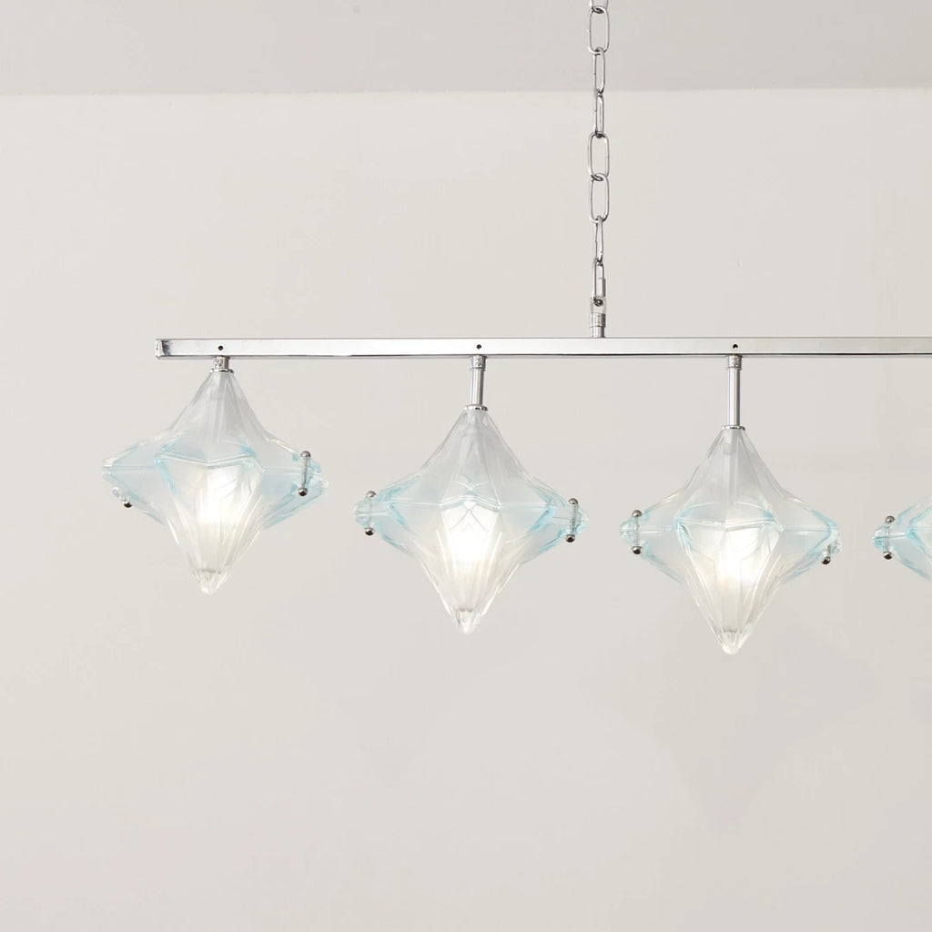 Angled View of Illuminated 7-Light Star Art Glass Linear Chandelier