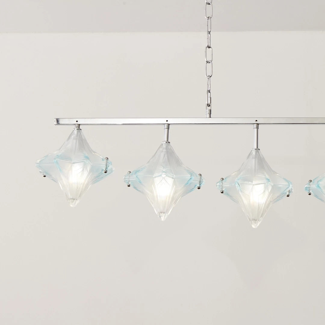 Angled View of Illuminated 7-Light Star Art Glass Linear Chandelier