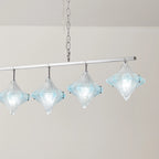 Angled View of Illuminated Modern Star Art Glass Linear Chandelier