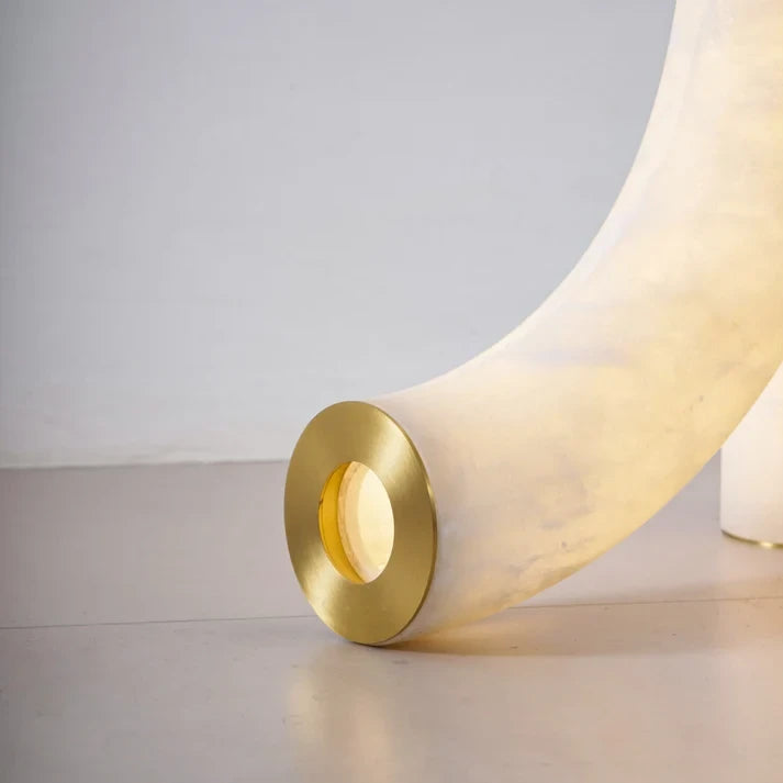 Close Up View of Curved Alabaster Leg and Brass Base Trim