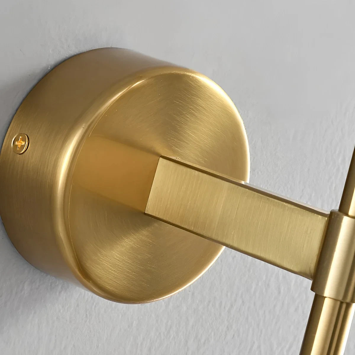 Close Up View of Brass Wall Mount Base and Extension Arm