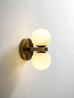 Side View of Illuminated Modern Double-Light Globe Wall Sconce