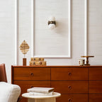 Modern Brass Globe Wall Sconce Over Living Room Sideboard