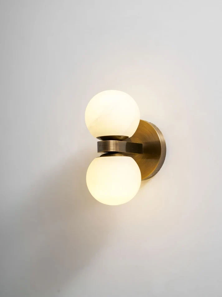 Angled View of Illuminated Modern Globe Art Glass Wall Sconce