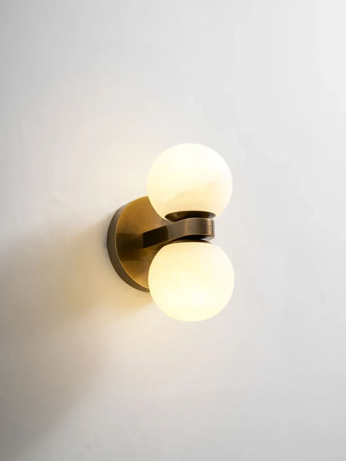 Studio Display of Illuminated Modern Double-Light Globe Wall Sconce