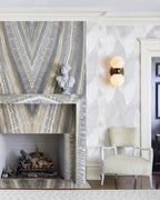 Modern Double-Light Wall Sconce Over Fireplace Setting