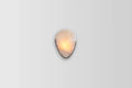 Side View of Illuminated Modern Oval Wall Sconce