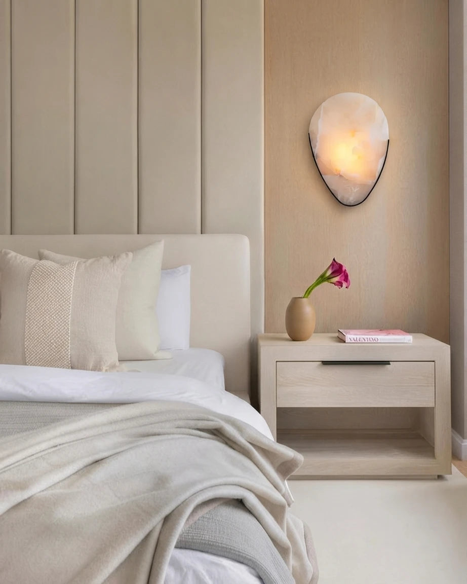 Modern Oval Wall Sconce in Bedroom Interior