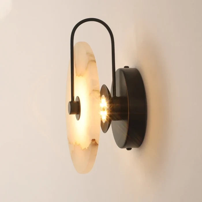 Illuminated Modern Round Alabaster Wall Sconce with Black Hardware Studio Display