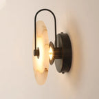 Illuminated Modern Round Alabaster Wall Sconce with Black Hardware Studio Display