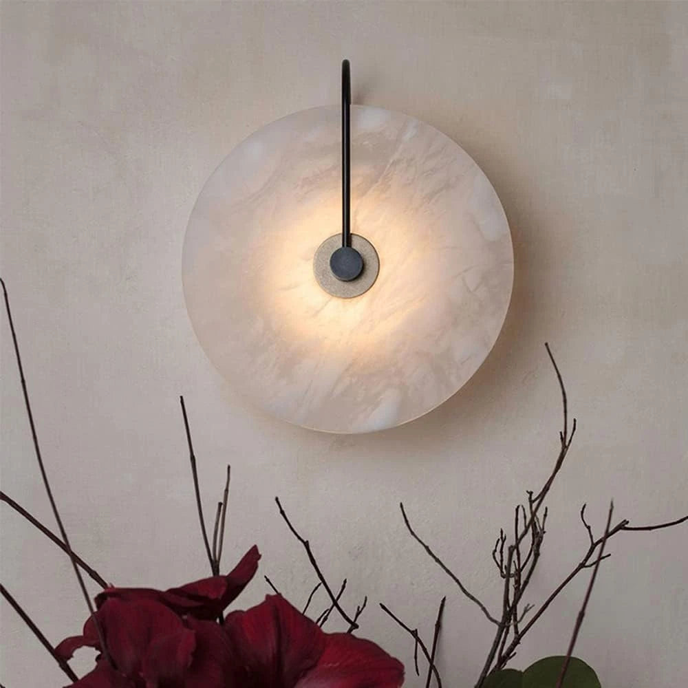 Side View of Illuminated Modern Round Alabaster Wall Sconce Studio Shot