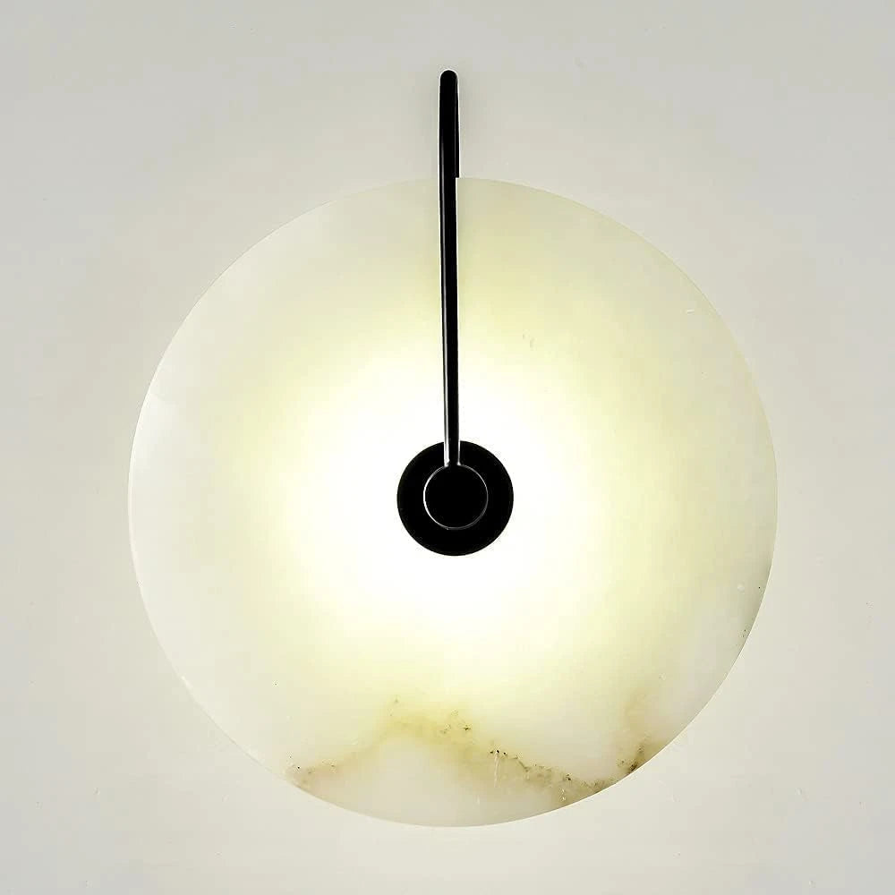 Front View of Illuminated Modern Round Alabaster Wall Sconce with Brass Stem