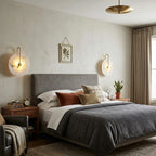 Modern Round Alabaster Wall Sconces in Master Bedroom Setting