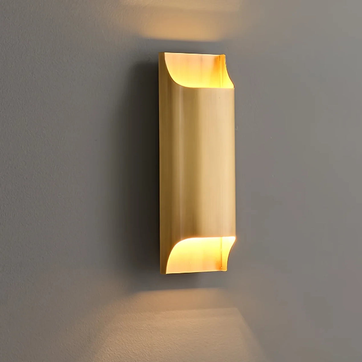 Illuminated Modern Brass Vertical Wall Sconce Studio Shot